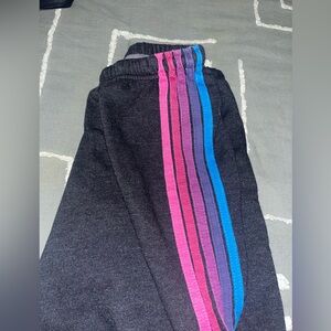 Aviator Nation Black Joggers with Pink, Purple, and Blue Stripes